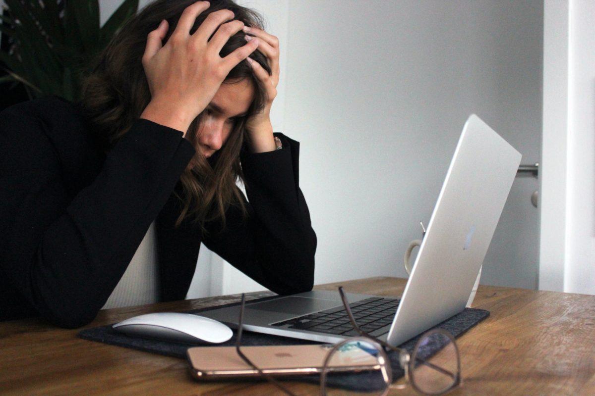Frustrated working on a laptop