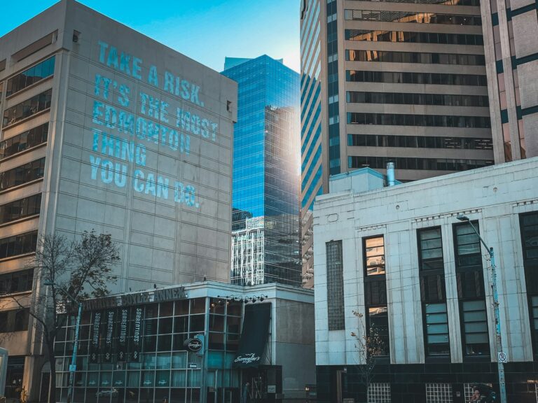Downtown Edmonton buildings with motivational wall mural