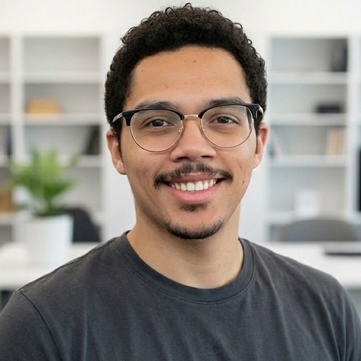 Smiling person wearing glasses in modern office